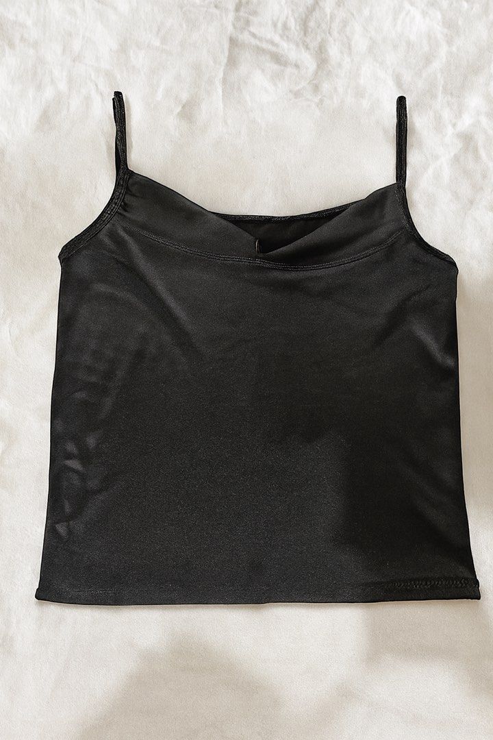 Black Satin Cami Top (Category: Sleeveless) located in Quezon City. Submitted by rhaez (Listing ID 1422483220, Image 1). Description: - Black satin cami top - Features thin straps - Scoop neckline - Solid black color - Simple and versatile design.