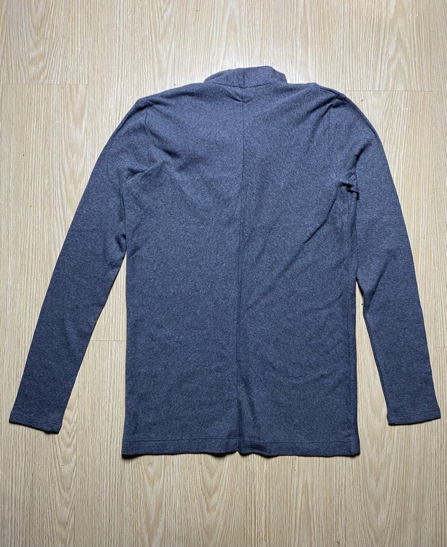 Brunello Cucinelli - Blue Cowl Neck Longsleeves (Category: Luxury Apparel) located in Olongapo. Submitted by copnsold (Listing ID 1422435262, Image 2). Description: Gray sweater from Brunello Cucinelli. Features a unique draped neckline and long sleeves. The size tag indicates a size L. Made in Italy. The sweater has a simple, elegant design, suitable for various occasions. The color is a versatile gray, making it easy to pair with different outf