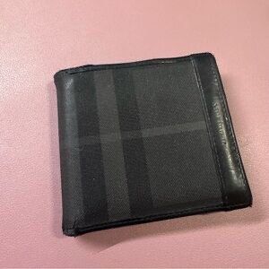 Burberry Checkered Wallet - Made in Italy (Category: Luxury Bags & Wallets) located in Tagbilaran City. Submitted by chawbello (Listing ID 1422528268, Image 1). Description: - Authentic Burberry wallet - Classic checkered pattern - Bi-fold design - Multiple card slots - Cash compartments - Black leather trim .