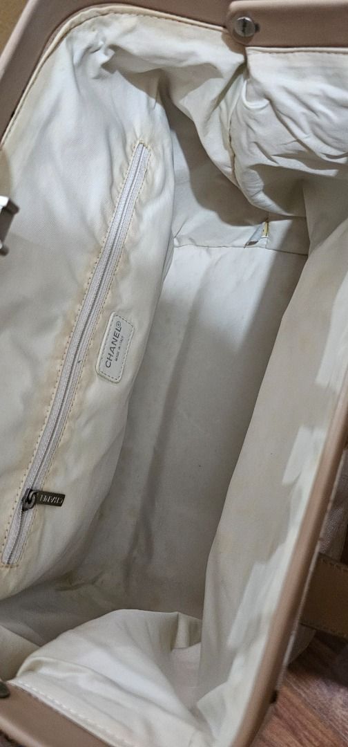 Chanel Beige Sports bag (authentic) (Category: Luxury Bags & Wallets) located in Manila. Submitted by mhelcgm (Listing ID 1422429488, Image 2). Description: - Beige handbag - Spacious interior - Zippered pocket inside - Chanel label - Structured design - Clasp closure - Light-colored interior lining - Handle for carrying.