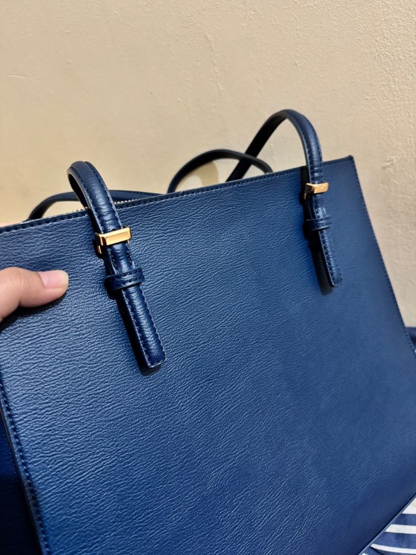 Charles & Keith Navy Blue Tote Bag (Category: Tote Bags) located in Subic. Submitted by e-clutter (Listing ID 1422533795, Image 2). Description: - large - long handle - with flaw on the strap at the back - already repaired with Mr Quickie .