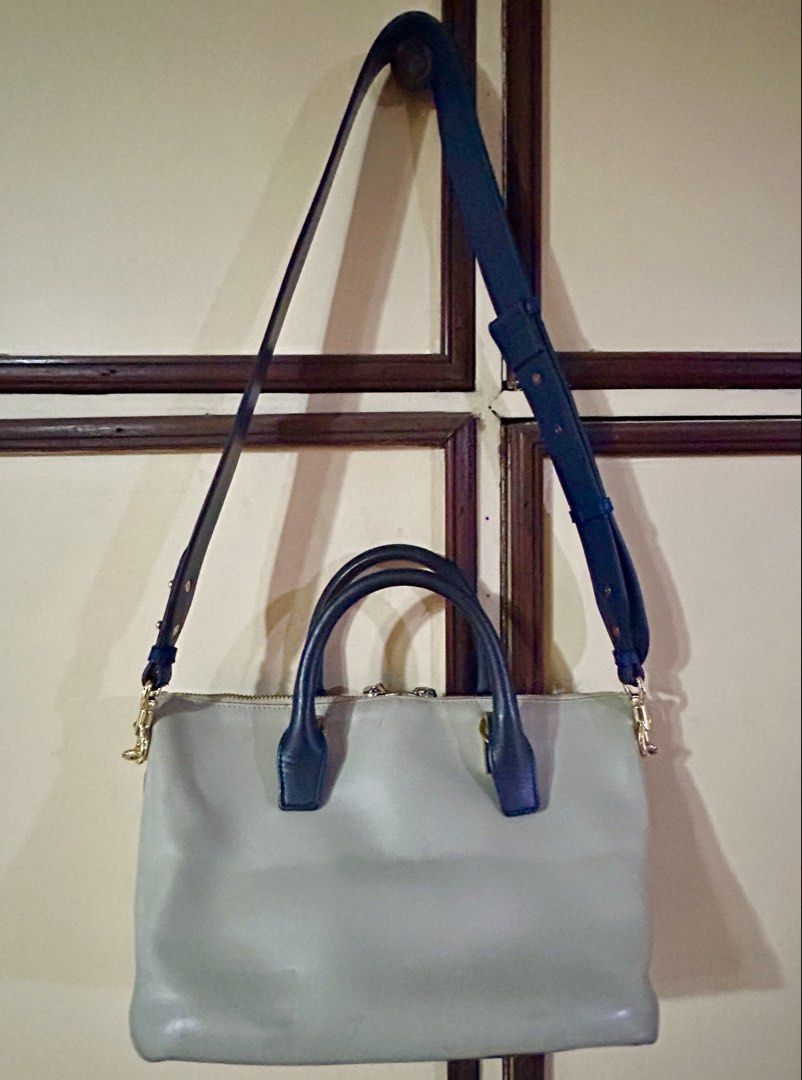 Chloe Baylee Handbag (Category: Luxury Bags & Wallets) located in Manila. Submitted by rosamanerds (Listing ID 1422413875, Image 2). Description: - Authentic preloved Chloe Baylee leather handbag in excellent condition. With minor signs of use (pls see 3rd pic) - Dual-tone design . Color is navy blue and taupe - Top handle and detachable shoulder strap - Gold-tone zipper and hardware - Interior with Chloe label and small pocket with holo sticker 