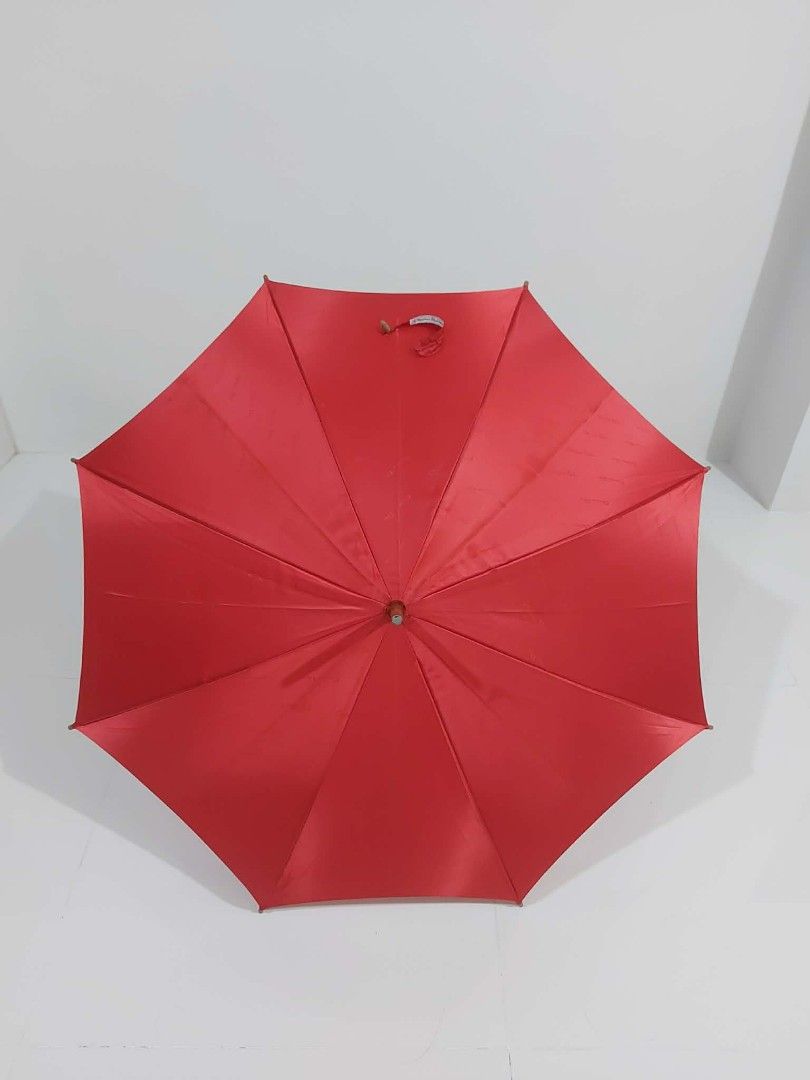 Christian Dior Red Umbrella (Category: Umbrellas) located in Bayombong. Submitted by Gentlemans_ClosEt (Listing ID 1422484534, Image 1). Description: - Authentic Christian Dior red umbrella - Subtle Dior logo inside - Wooden handle with Dior ring - Includes carrying strap - Vibrant red color - Perfect for rainy days.