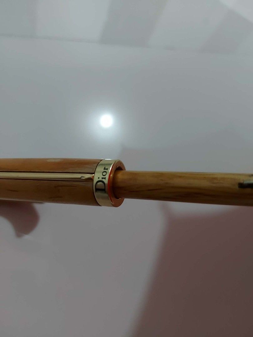 Christian Dior Red Umbrella (Category: Umbrellas) located in Bayombong. Submitted by Gentlemans_ClosEt (Listing ID 1422484534, Image 3). Description: - Authentic Christian Dior red umbrella - Subtle Dior logo inside - Wooden handle with Dior ring - Includes carrying strap - Vibrant red color - Perfect for rainy days.
