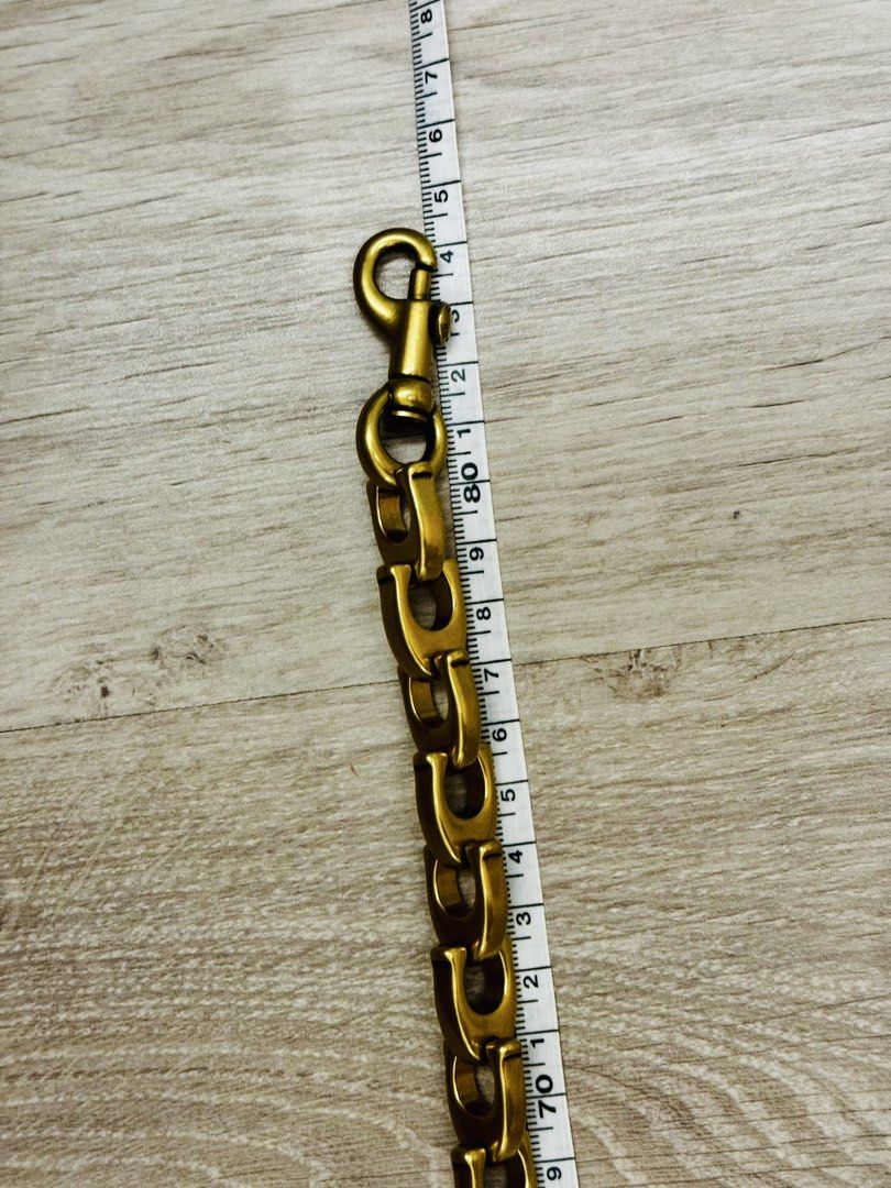 Coach “c” chain strap good for vintage or new release (Category: Accessory Holder, Box & Organizers) located in Manila. Submitted by saleph (Listing ID 1422402392, Image 3). Description: Firm on price. Ultra rare item. Approx 84cm length. Metal brass feel. Vintage gold finish pairs well with vintage coach bags or other luxury bags. .