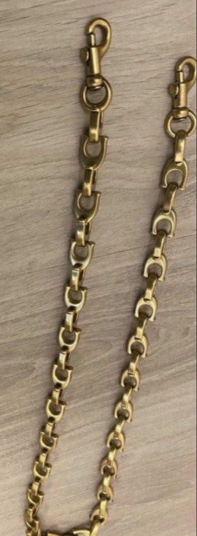 Coach “c” chain strap good for vintage or new release (Category: Accessory Holder, Box & Organizers) located in Manila. Submitted by saleph (Listing ID 1422402392, Image 1). Description: Firm on price. Ultra rare item. Approx 84cm length. Metal brass feel. Vintage gold finish pairs well with vintage coach bags or other luxury bags. .
