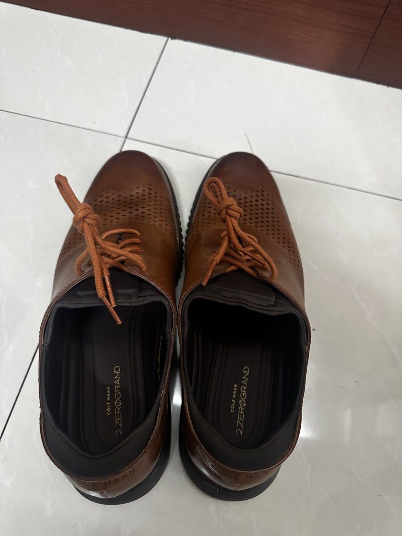 Cole Haan 2.zerogrand Men's Shoes (Category: Casual Shoes) located in Quezon City. Submitted by kishanity (Listing ID 1422393408, Image 2). Description: - Cole Haan 2.ZEROGRAND men's shoes - Brown color - Size 10.5M - Perforated design - Lace-up closure - Dark brown soles - Features Cole Haan logo .