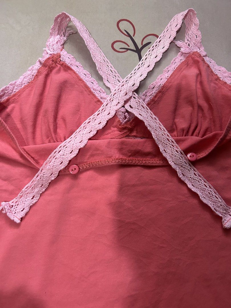 Pink Tank Top with Lace Trim (Category: Sleeveless) located in Quezon City. Submitted by rhaez (Listing ID 1422478973, Image 2). Description: SUPER STEAL! The strap can be normal, crossed, or halter! - Coral pink tank top - Delicate pink lace trim - V-neckline - Criss-cross back design - Lace detailing on straps and neckline - Two buttons at the back - Perfect for various occasions.