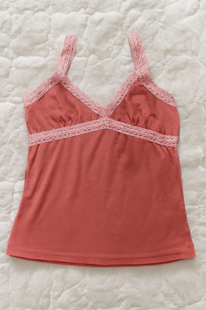 Pink Tank Top with Lace Trim (Category: Sleeveless) located in Quezon City. Submitted by rhaez (Listing ID 1422478973, Image 1). Description: SUPER STEAL! The strap can be normal, crossed, or halter! - Coral pink tank top - Delicate pink lace trim - V-neckline - Criss-cross back design - Lace detailing on straps and neckline - Two buttons at the back - Perfect for various occasions.