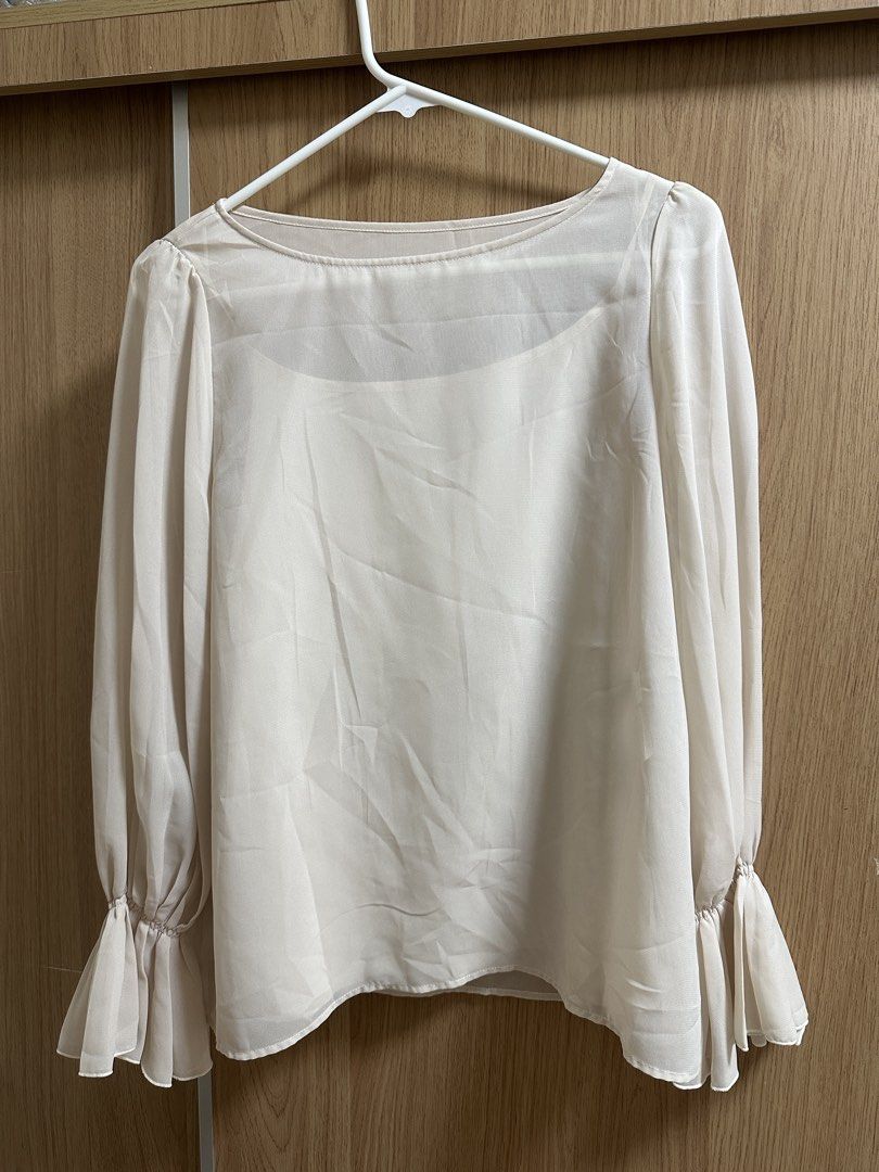 Cream-colored Long Sleeve Blouse (Category: Blouses) located in Santa Rosa. Submitted by krxtnm (Listing ID 1422406802, Image 1). Description: - Cream-colored blouse - Long sleeves - Round neckline - Flared cuffs - Lightweight, flowy fabric - Versatile for casual and semi-formal occasions.