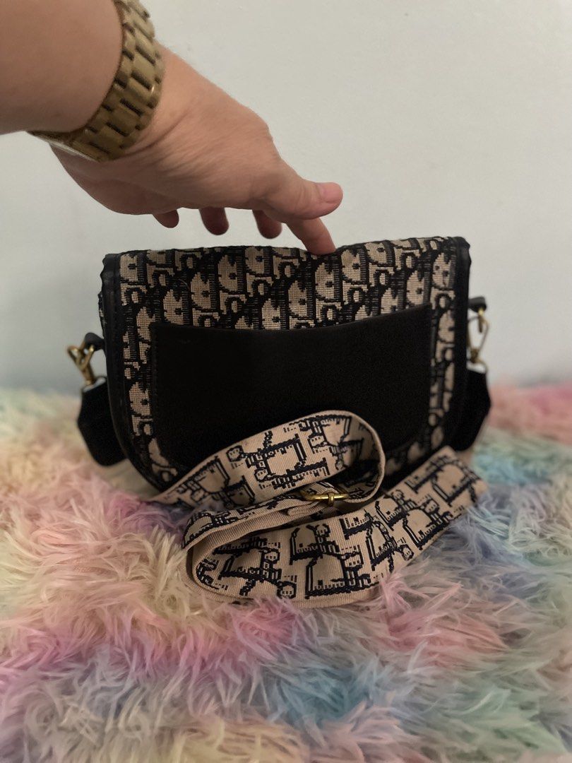 Dior Saddle Bag with Strap (Category: Luxury Bags & Wallets) located in Pasig City. Submitted by ladyboss1012 (Listing ID 1422484783, Image 2). Description: - Dior Saddle Bag - Iconic Dior Oblique pattern - Detachable strap for shoulder or crossbody wear - Flap closure with gold-tone CD buckle - Single interior compartment.