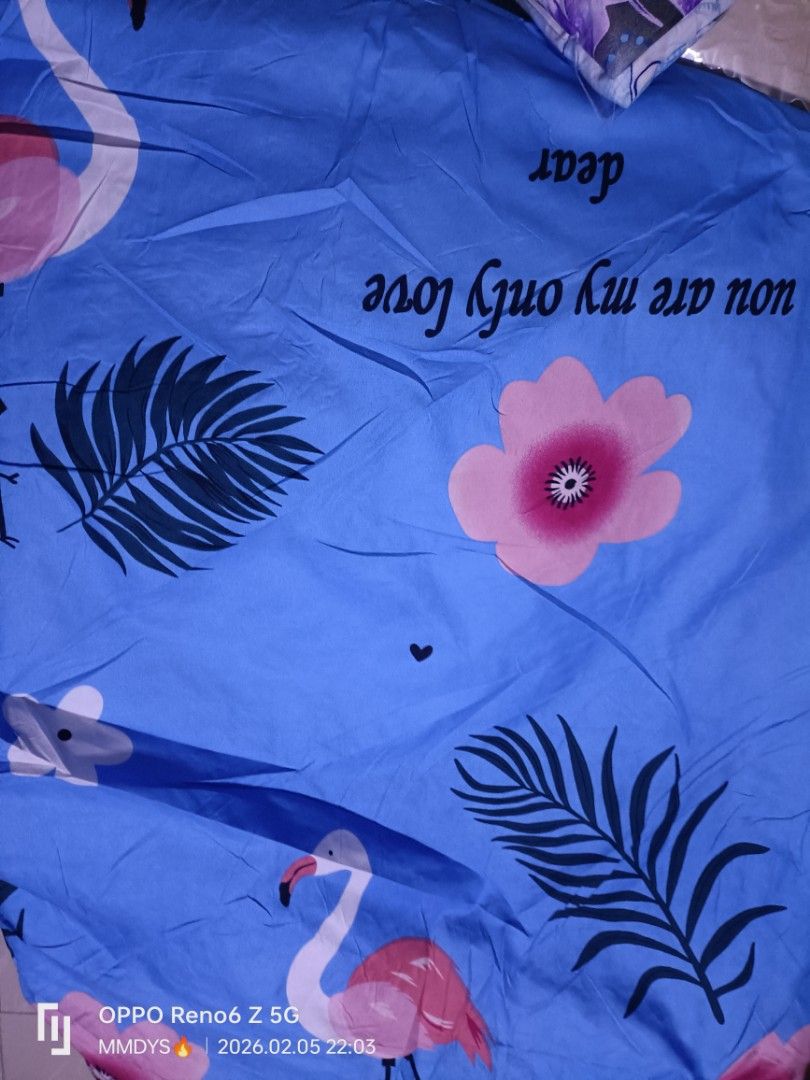 Floral and Patterned Bed Sheets (Category: Bedding & Towels) located in Manila. Submitted by francescla70567 (Listing ID 1422403166, Image 3). Description: - Variety of bed sheet designs: floral and patterned. - Designs include: blue roses, white flowers, flamingos, and geometric patterns. - Available in shades of blue, white, and other colors. - Perfect for adding style to your bedroom..