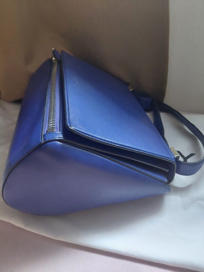 Givenchy Blue Leather Bag (Category: Luxury Bags & Wallets) located in Pasig City. Submitted by redellie (Listing ID 1422427369, Image 3). Description: - Authentic Givenchy bag - Striking blue leather exterior - Unique geometric design - Zippered closure - Shoulder strap - Gold-toned hardware - Spacious interior with pockets - Includes dust bag - Stylish and functional design - Adjustable straps. shoulder and cross body.
