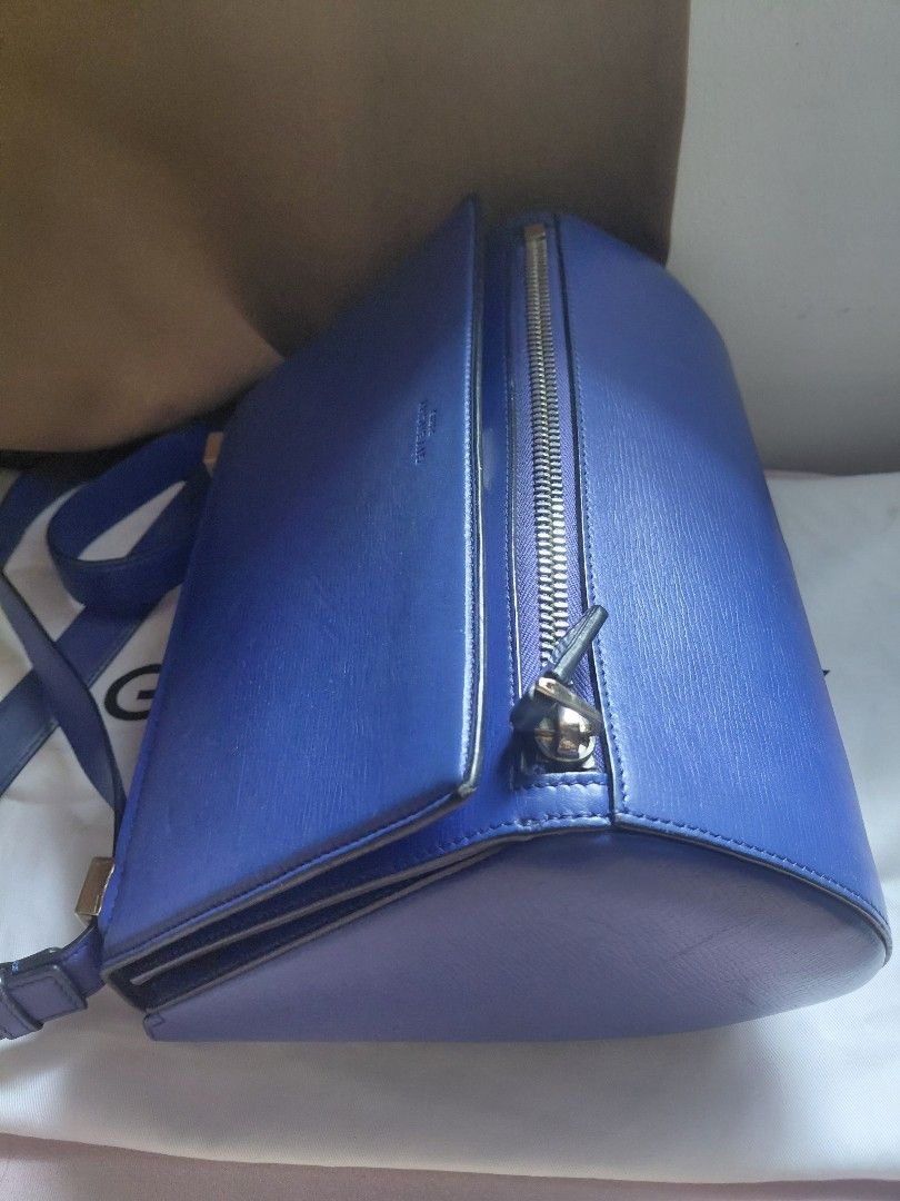 Givenchy Blue Leather Bag (Category: Luxury Bags & Wallets) located in Pasig City. Submitted by redellie (Listing ID 1422427369, Image 2). Description: - Authentic Givenchy bag - Striking blue leather exterior - Unique geometric design - Zippered closure - Shoulder strap - Gold-toned hardware - Spacious interior with pockets - Includes dust bag - Stylish and functional design - Adjustable straps. shoulder and cross body.