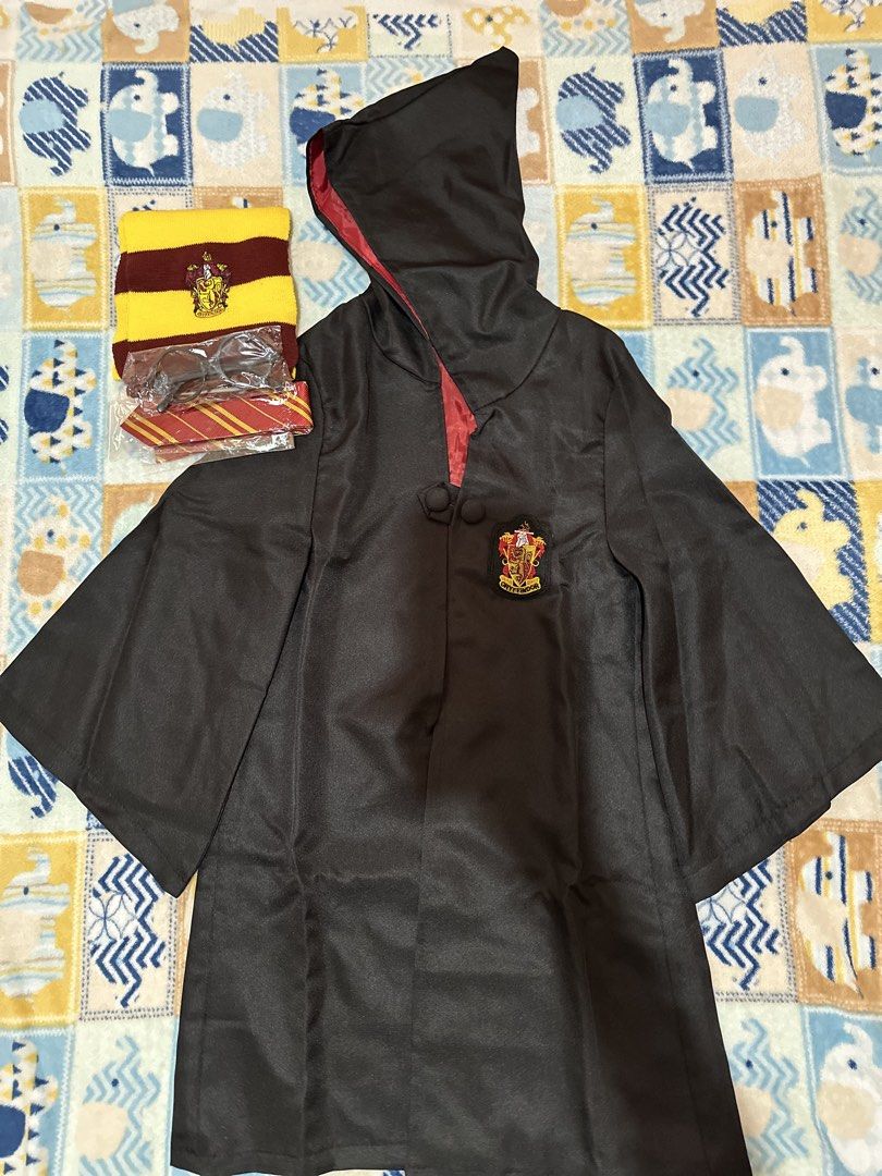 Harry Potter- Gryffindor Robe and Accessories Set (Category: Babies & Kids Fashion) located in Pila. Submitted by airrapreloved_ (Listing ID 1422389000, Image 1). Description: - Gryffindor robe with crest and hood - Gryffindor scarf - Red and gold striped tie - Round glasses - Ideal for Harry Potter enthusiasts! 📣Wala na po yung wand nasira ng anak ko☺️ Isang beses lang nagamit for pictorial lang. .