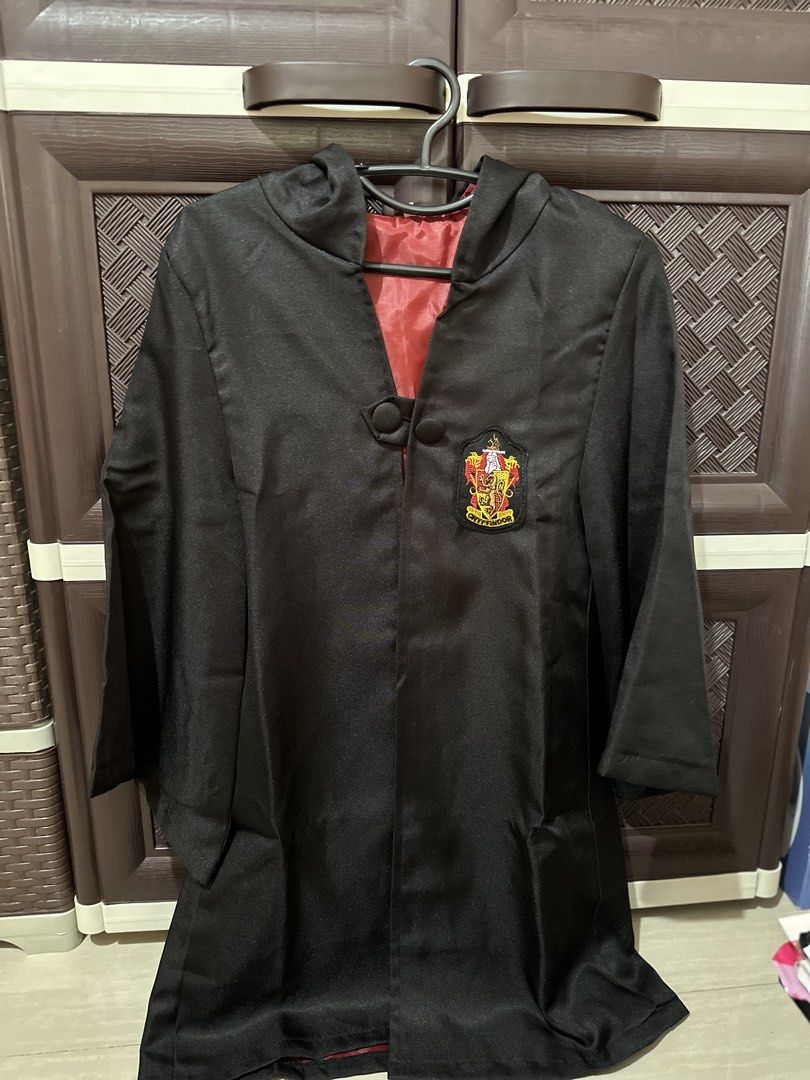 Harry Potter- Gryffindor Robe and Accessories Set (Category: Babies & Kids Fashion) located in Pila. Submitted by airrapreloved_ (Listing ID 1422389000, Image 2). Description: - Gryffindor robe with crest and hood - Gryffindor scarf - Red and gold striped tie - Round glasses - Ideal for Harry Potter enthusiasts! 📣Wala na po yung wand nasira ng anak ko☺️ Isang beses lang nagamit for pictorial lang. .