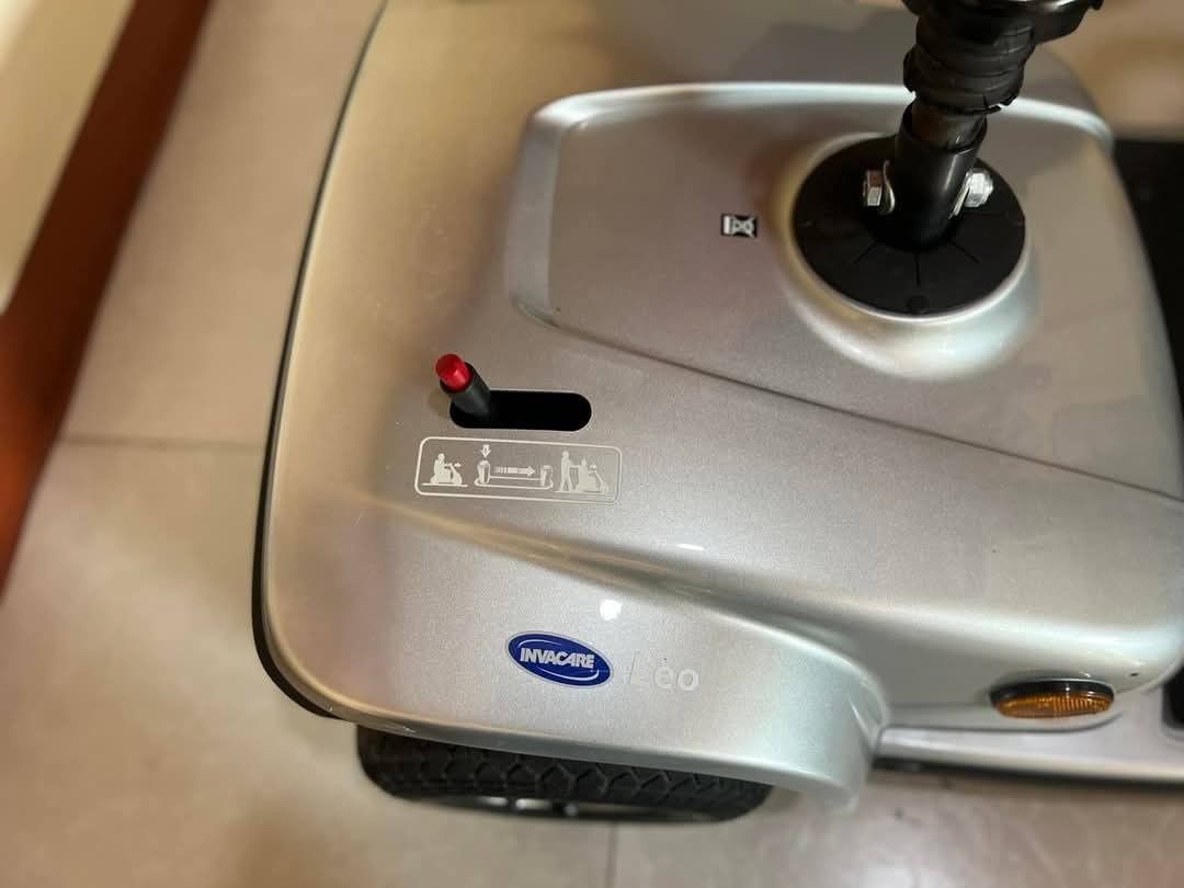 Invacare Leo Mobility Scooter (Category: Medical Supplies & Tools) located in Manila. Submitted by gracepangan_02 (Listing ID 1422544571, Image 3). Description: - Invacare Leo mobility scooter - Silver color - Comfortable black seat with armrests and headrest - Includes front basket - Rear light - Four wheels - Control panel with handlebar - Invacare logo visible - In good working condition.
