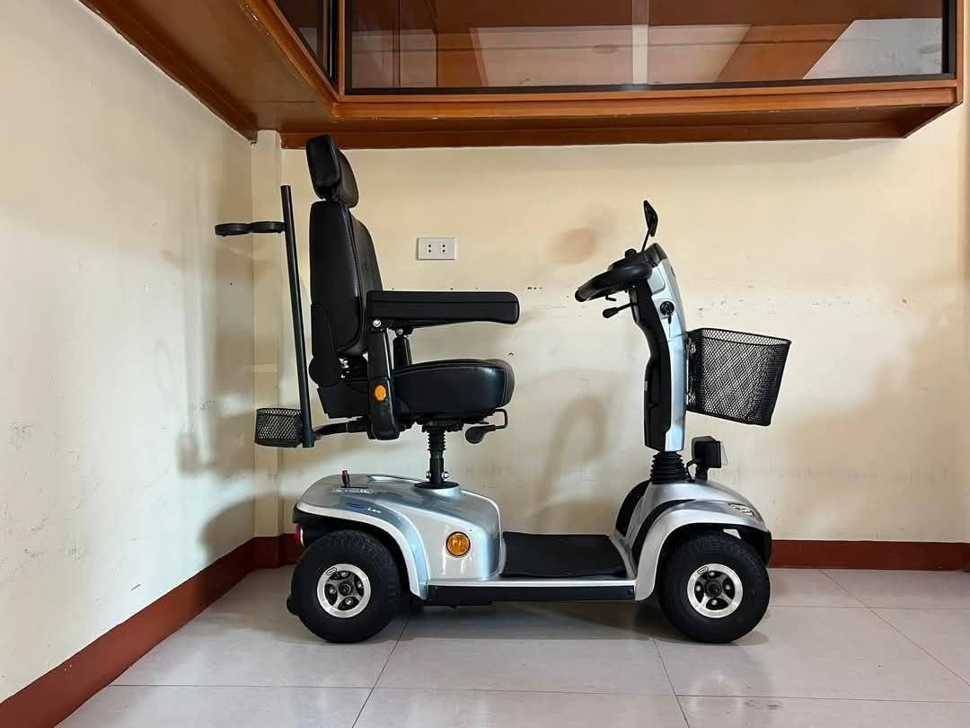Invacare Leo Mobility Scooter (Category: Medical Supplies & Tools) located in Manila. Submitted by gracepangan_02 (Listing ID 1422544571, Image 1). Description: - Invacare Leo mobility scooter - Silver color - Comfortable black seat with armrests and headrest - Includes front basket - Rear light - Four wheels - Control panel with handlebar - Invacare logo visible - In good working condition.
