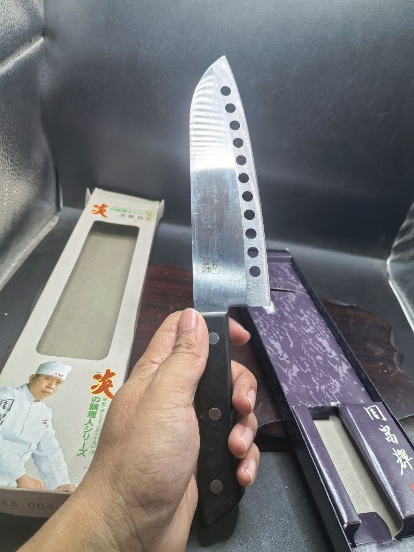 Knife- Japanese-Style Kitchen Knife (Category: Knives & Chopping Boards) located in Cebu City. Submitted by dudes_villanueva (Listing ID 1422517611, Image 1). Description: Knife- Japanese-Style Kitchen Knife Made in China - Japan Quality Brand New. 📌A versatile knife (万能包丁) often referred to as a Santoku. 📌Purpose: Designed for professional culinary use, likely for slicing, dicing, and chopping various ingredients. 📌Features: The blade has dis