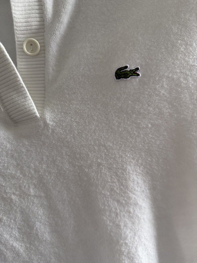 Lacoste Slim Fit Polo Shirt (Category: Blouses) located in Lipa City. Submitted by jenragragio (Listing ID 1422447253, Image 2). Description: - White Lacoste polo shirt - Size: 40 - Fit: Slim - Features a classic polo collar - Short sleeves - Iconic Lacoste logo on chest - Button-up placket - Fabric: Textured knit.