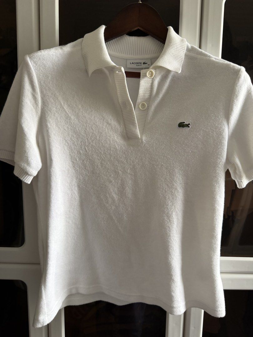 Lacoste Slim Fit Polo Shirt (Category: Blouses) located in Lipa City. Submitted by jenragragio (Listing ID 1422447253, Image 1). Description: - White Lacoste polo shirt - Size: 40 - Fit: Slim - Features a classic polo collar - Short sleeves - Iconic Lacoste logo on chest - Button-up placket - Fabric: Textured knit.
