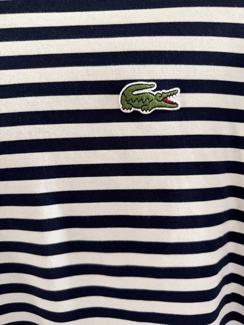 Lacoste Striped Long Sleeve Shirt (Category: Longsleeves) located in Lipa City. Submitted by jenragragio (Listing ID 1422446840, Image 2). Description: - Lacoste long sleeve shirt - Navy and white stripes - Size 40 - Features the iconic Lacoste crocodile logo - Regular fit - Crew neck - Ideal for casual wear.
