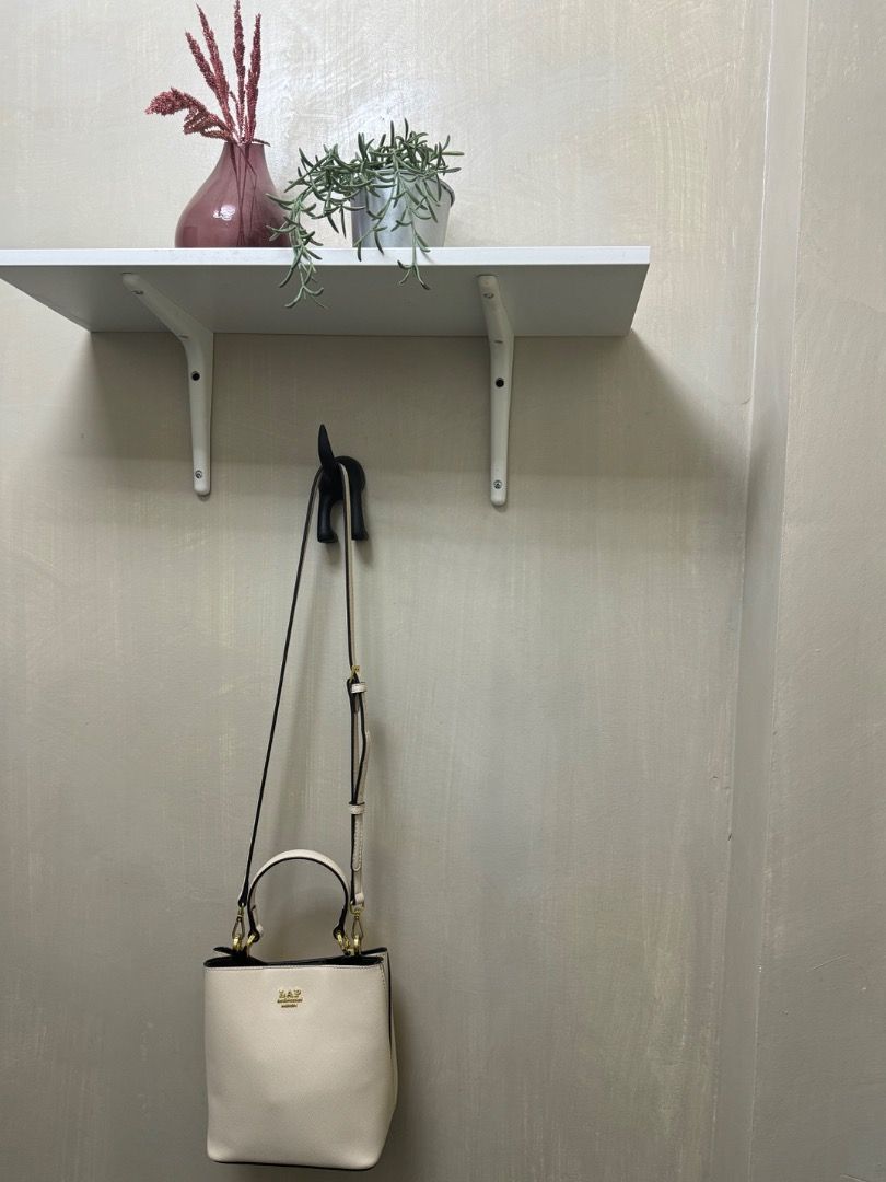 LAP Bucket 2-way Crossbody Bag (Category: Luxury Bags & Wallets) located in Subic. Submitted by e-clutter (Listing ID 1422530587, Image 2). Description: - Cream-colored bucket bag - Top handle and detachable shoulder strap - Gold-colored hardware.