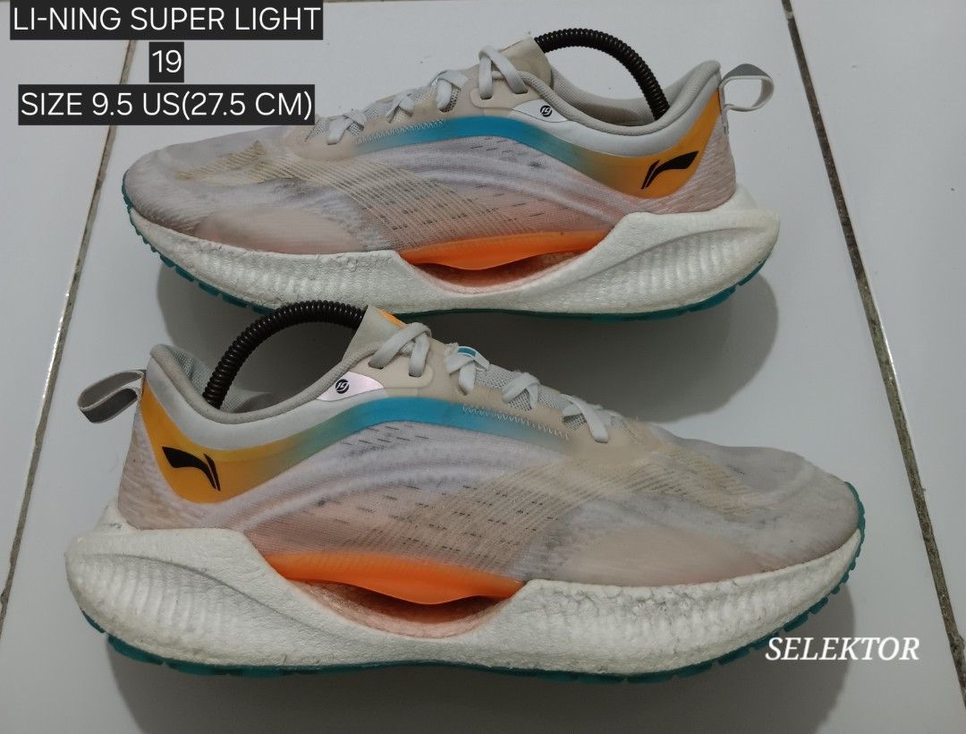 Li-Ning Super Light 19 Running Shoes - Size 9.5 (Category: Sneakers) located in Dauis. Submitted by udenglegaspi (Listing ID 1422459312, Image 1). Description: - Li-Ning Super Light 19 running shoes - Size: 9.5 US (27.5 CM) - Color: White, orange, and blue - Sole color: Teal - Features a mesh upper - Made in China.