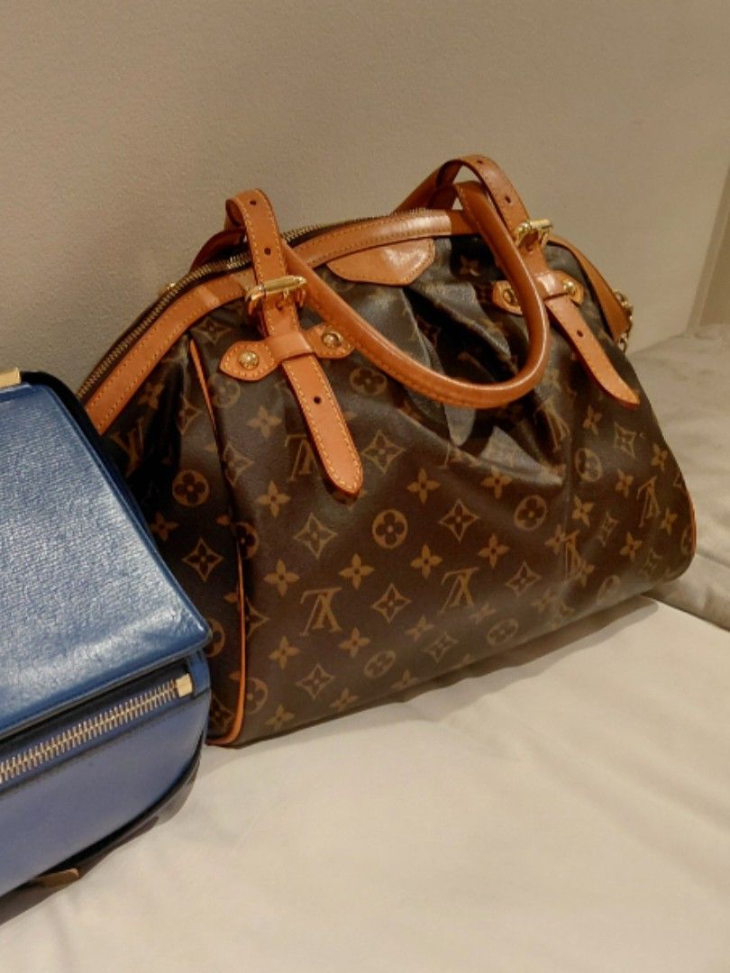 Louis Vuitton Tivoli (Category: Luxury Bags & Wallets) located in Pasig City. Submitted by redellie (Listing ID 1422430366, Image 2). Description: Monogram coated canvas. Material is paired with natural Vachetta cowhide leather trim and handles, featuring gold-tone brass hardware. inclusion: dustbag and original receipt.
