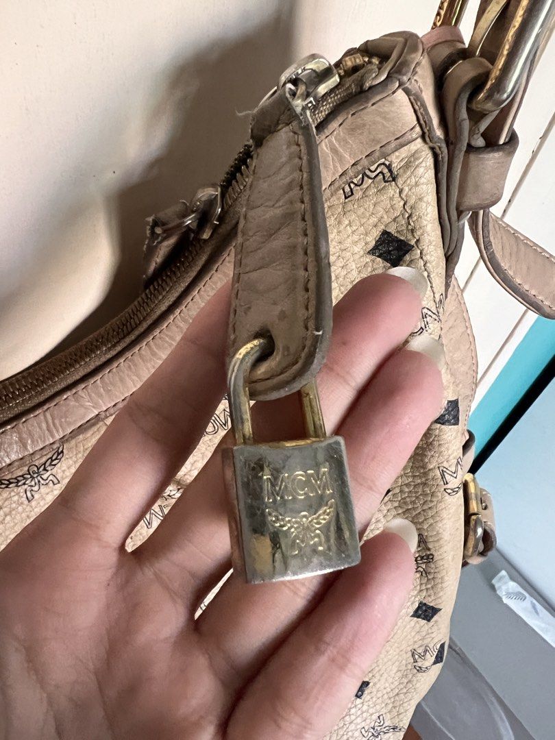 MCM Shoulder Bag (Category: Luxury Bags & Wallets) located in Manila. Submitted by bby.yng (Listing ID 1422462883, Image 3). Description: - Authentic pre-loved MCM bag - signs of usage, discoloration - working zipper - looks vintage - with free dust bag.