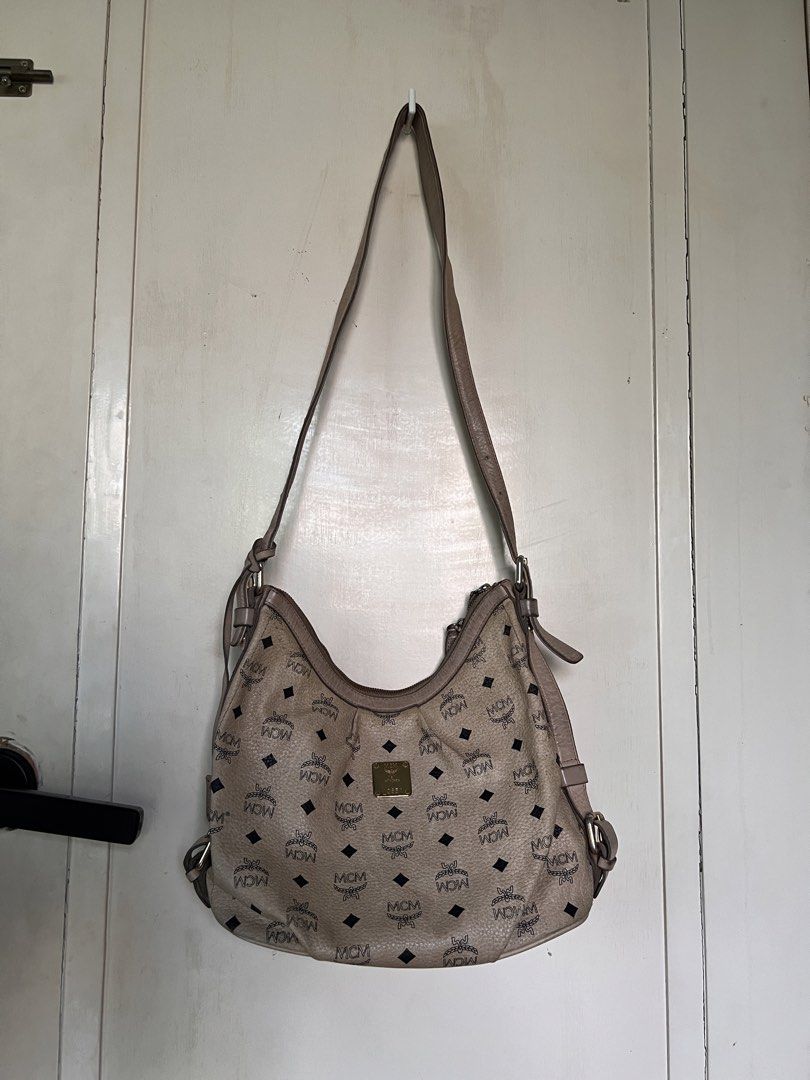 MCM Shoulder Bag (Category: Luxury Bags & Wallets) located in Manila. Submitted by bby.yng (Listing ID 1422462883, Image 2). Description: - Authentic pre-loved MCM bag - signs of usage, discoloration - working zipper - looks vintage - with free dust bag.
