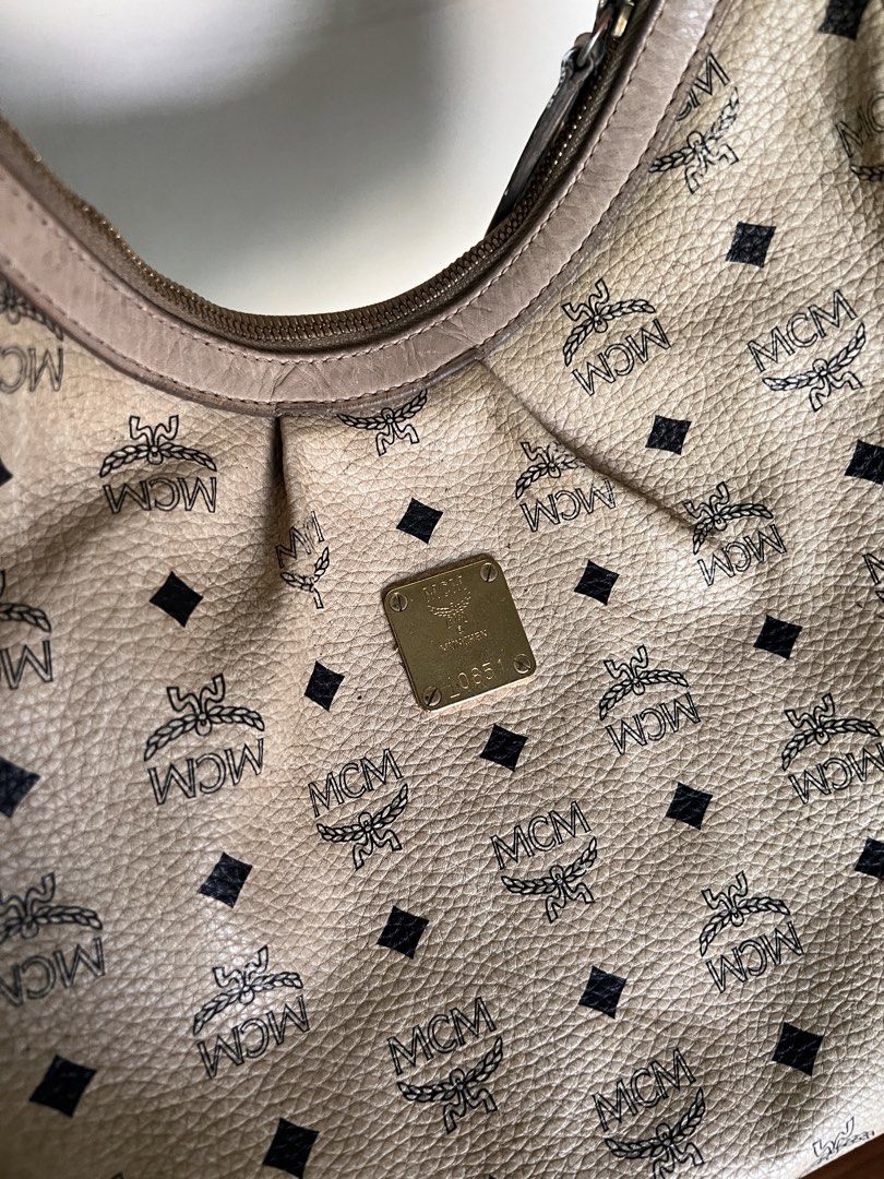 MCM Shoulder Bag (Category: Luxury Bags & Wallets) located in Manila. Submitted by bby.yng (Listing ID 1422462883, Image 1). Description: - Authentic pre-loved MCM bag - signs of usage, discoloration - working zipper - looks vintage - with free dust bag.