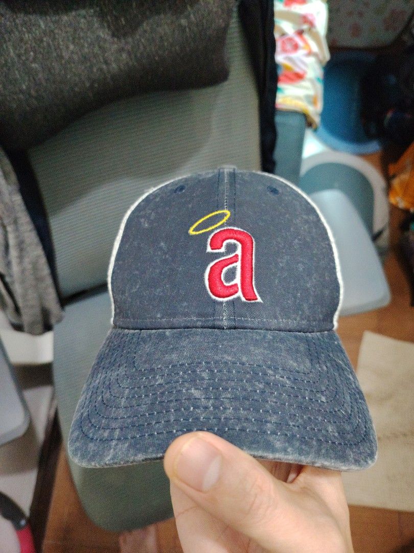 New Era California Angels MLB Cap (Category: Caps & Hats) located in Makati City. Submitted by jayclutter0976004 (Listing ID 1422398057, Image 1). Description: - Official California Angels cap - 9FORTY model - Navy blue and white colorway - Features the Angels logo with a red 'a' and halo - Mesh back for breathability - Curved brim - One size fits most.