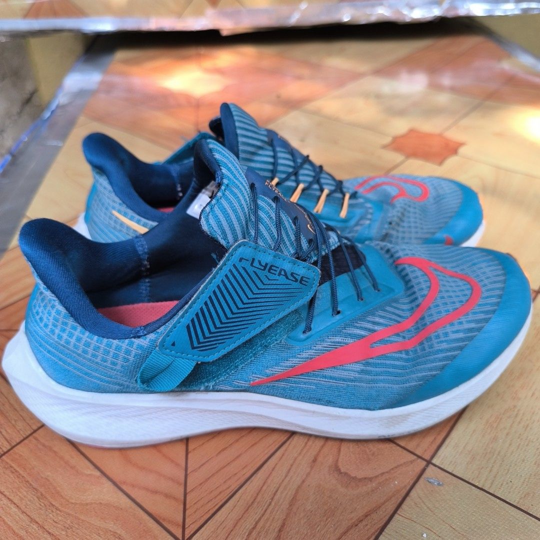 Nike Pegasus Zoom FlyEase Running Shoes (Category: Sneakers) located in Dasmarinas. Submitted by calmforest.e4c71e.643 (Listing ID 1422396257, Image 2). Description: - Nike Zoom FlyEase running shoes - Teal and orange colorway - FlyEase system for easy on and off - White midsole - Red and orange outsole - Visible Nike swoosh very good condition bouncy running shoes 1000 pesos only open for jnt or lalamove dasma cavite location .