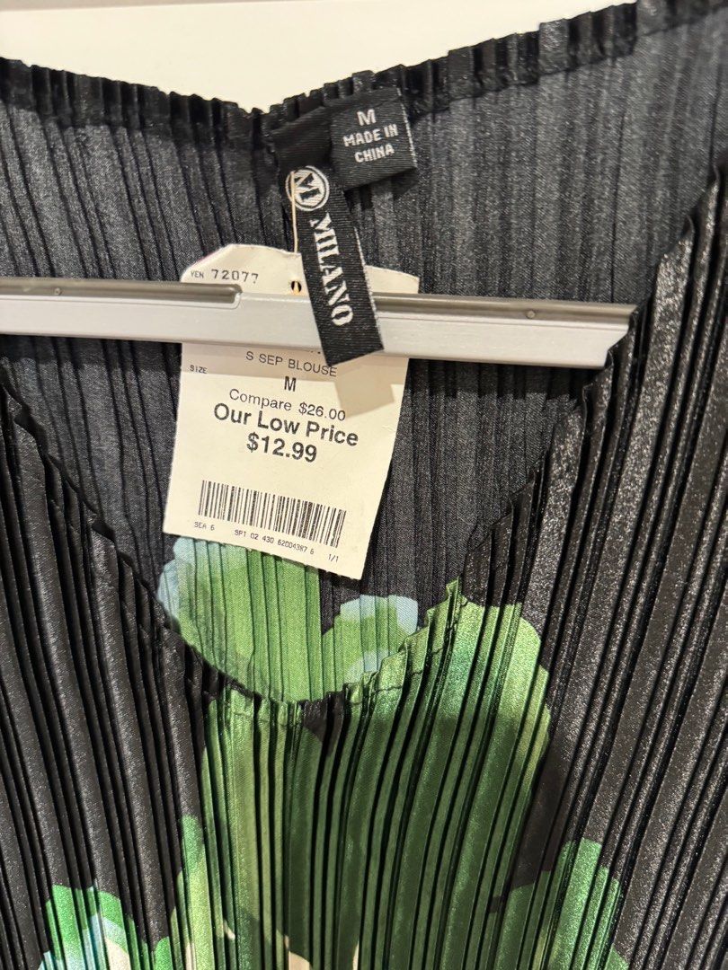 Pleated, miyaki top - Medium brand new - (Category: Others Tops) located in Manila. Submitted by goinggreener (Listing ID 1422465646, Image 2). Description: Black with green flower like accent - medium, bought but never used. Tag is attached - .