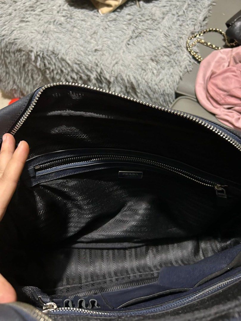 Prada Briefcase (Category: Luxury Bags & Wallets) located in Manila. Submitted by nicebag90 (Listing ID 1422482334, Image 3). Description: - Prada briefcase in navy blue - Striped design - Top handle - Zipper closure - Interior zipper pocket - Prada logo tag - Made in Italy - Spacious interior.