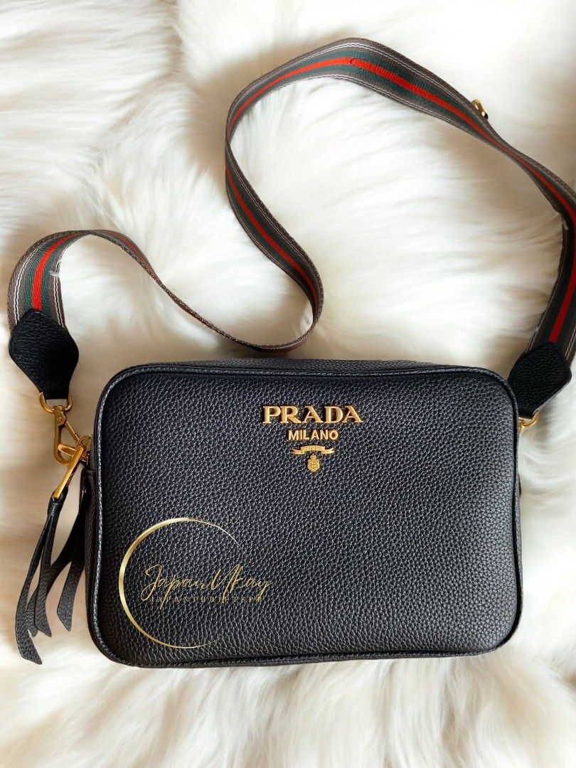 Prada Daino Camera Bag (Category: Luxury Bags & Wallets) located in Las Pinas. Submitted by jadasy_vintagefinds (Listing ID 1422421128, Image 2). Description: Prada Daino Camera Bag, Double Zip, double strap, in great condition. No papers, cards, receipt. Riri Zipper. 📦 LBC, JNT, JRS Provincial Areas 💸 COD in Metro Manila only 🛵 Same-day delivery via Lalamove/Grab 🌏 Worldwide Shipping via EMS/DHL 📍Store pick up (Dasma Cavite) .