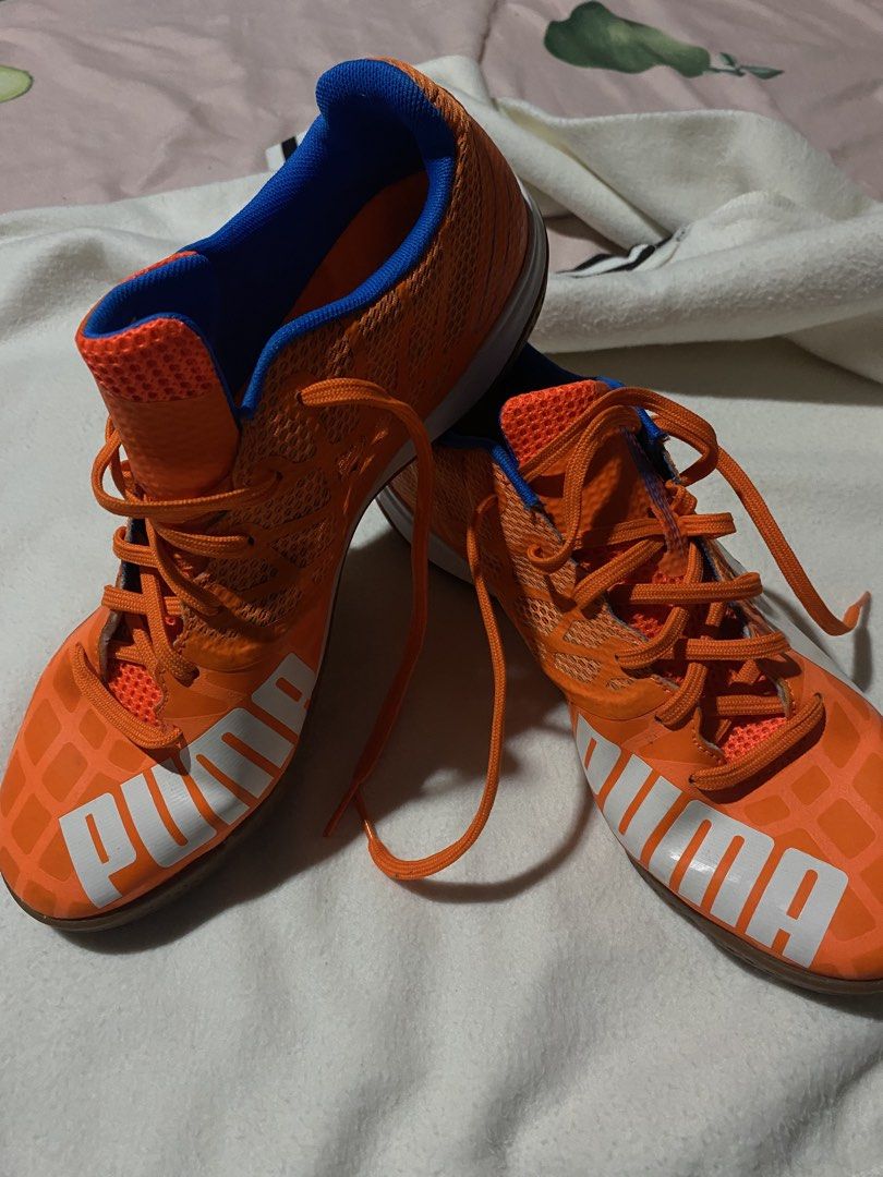 Puma Indoor Soccer Shoes (Category: Sneakers) located in Manila. Submitted by pecsonmalouv.40 (Listing ID 1422480526, Image 1). Description: - Orange Puma indoor soccer shoes - Orange laces - White Puma logo - Blue interior - Textured upper.