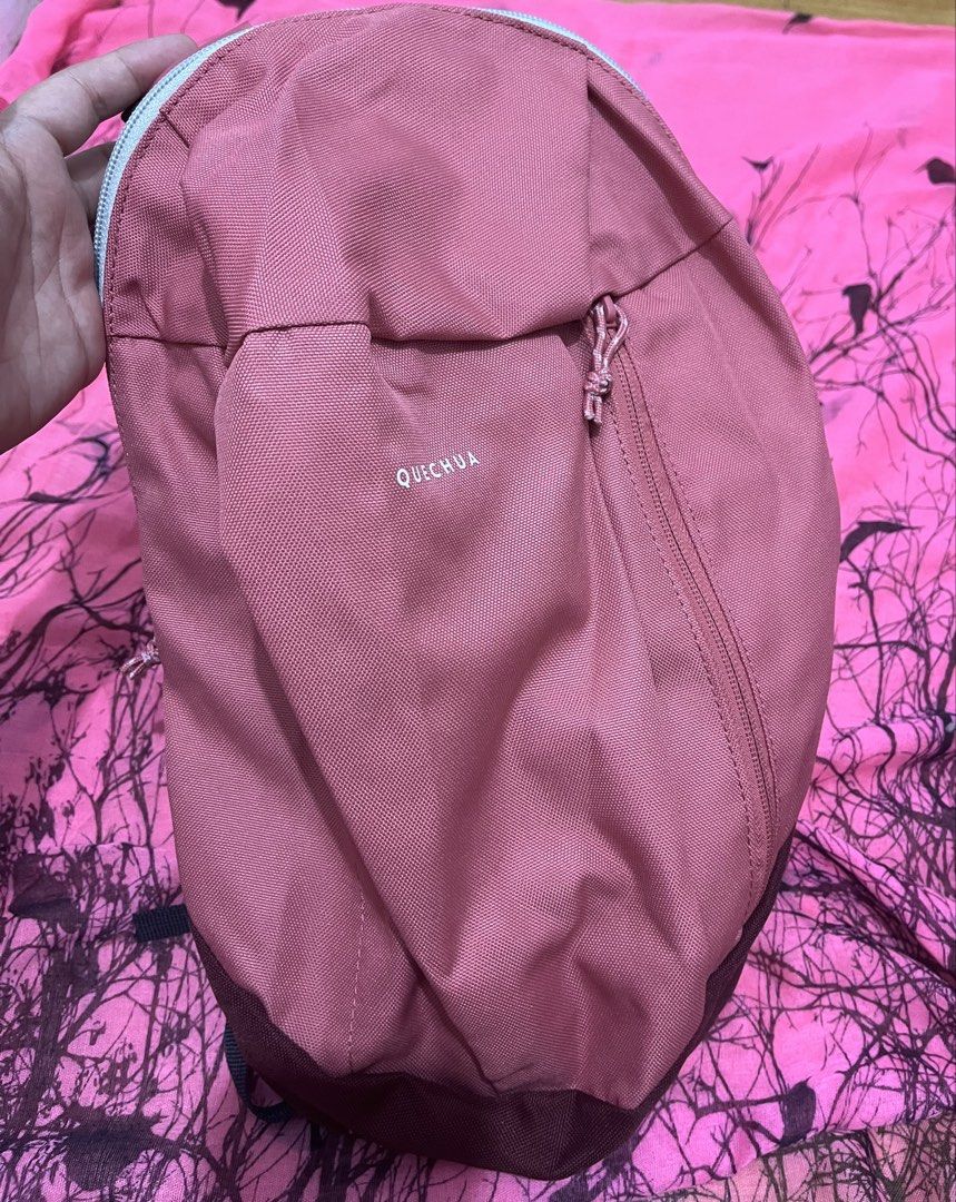 Quechua Backpack (Category: Backpacks) located in Rizal. Submitted by roldanroxanne1129 (Listing ID 1422490027, Image 1). Description: - Quechua backpack - Zippered main compartment - Front pocket - Durable fabric - Rounded shape - Solid color - Zipper closure - Top handle - Visible Quechua logo.