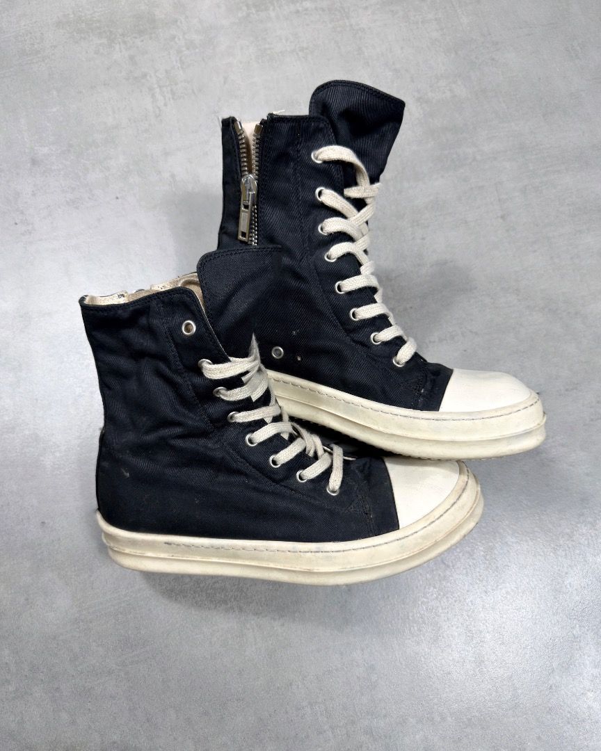 Rick Owens - Ramones High Top Sneakers (Category: Sneakers) located in Subic. Submitted by concretefloor (Listing ID 1422399640, Image 3). Description: Rick Owens - Ramones High Top Sneakers Size 41 Fits 8.5-9 Mens - Black high-top sneakers - White soles and toe caps - Side zipper and lace-up closure - Canvas-like material - Made in Italy No major flaw Wearable condition 9/10 condition .