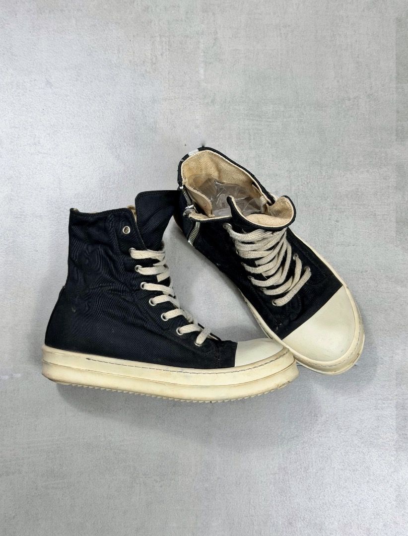 Rick Owens - Ramones High Top Sneakers (Category: Sneakers) located in Subic. Submitted by concretefloor (Listing ID 1422399640, Image 2). Description: Rick Owens - Ramones High Top Sneakers Size 41 Fits 8.5-9 Mens - Black high-top sneakers - White soles and toe caps - Side zipper and lace-up closure - Canvas-like material - Made in Italy No major flaw Wearable condition 9/10 condition .