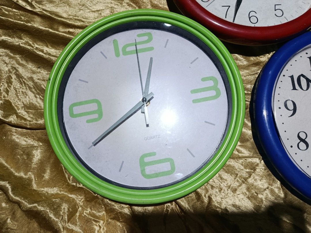 Take it All Bundle Round Wall Clock for Parts Display (Category: Clocks) located in Quezon City. Submitted by truephoenix.16cee3 (Listing ID 1422477639, Image 2). Description: Condition used, not working. Manage expectations. For parts and display. Color green - glass, the body not attached to the glass frame. Not working. Color red - not working, plastic cover Color blue - not working, plastic cover, many scratches Sold for bundle. Package inclu