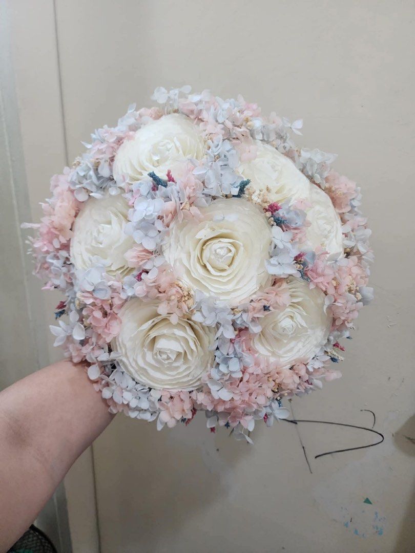 Round Wedding Bouquet with Pastel Flowers (Category: Flowers & Bouquets) located in Pasay City. Submitted by shirley.manacsa (Listing ID 1422471387, Image 1). Description: - Stunning round bouquet. - Features large white flowers. - Accented with pastel pink and blue blooms. - Perfect for weddings and special occasions..