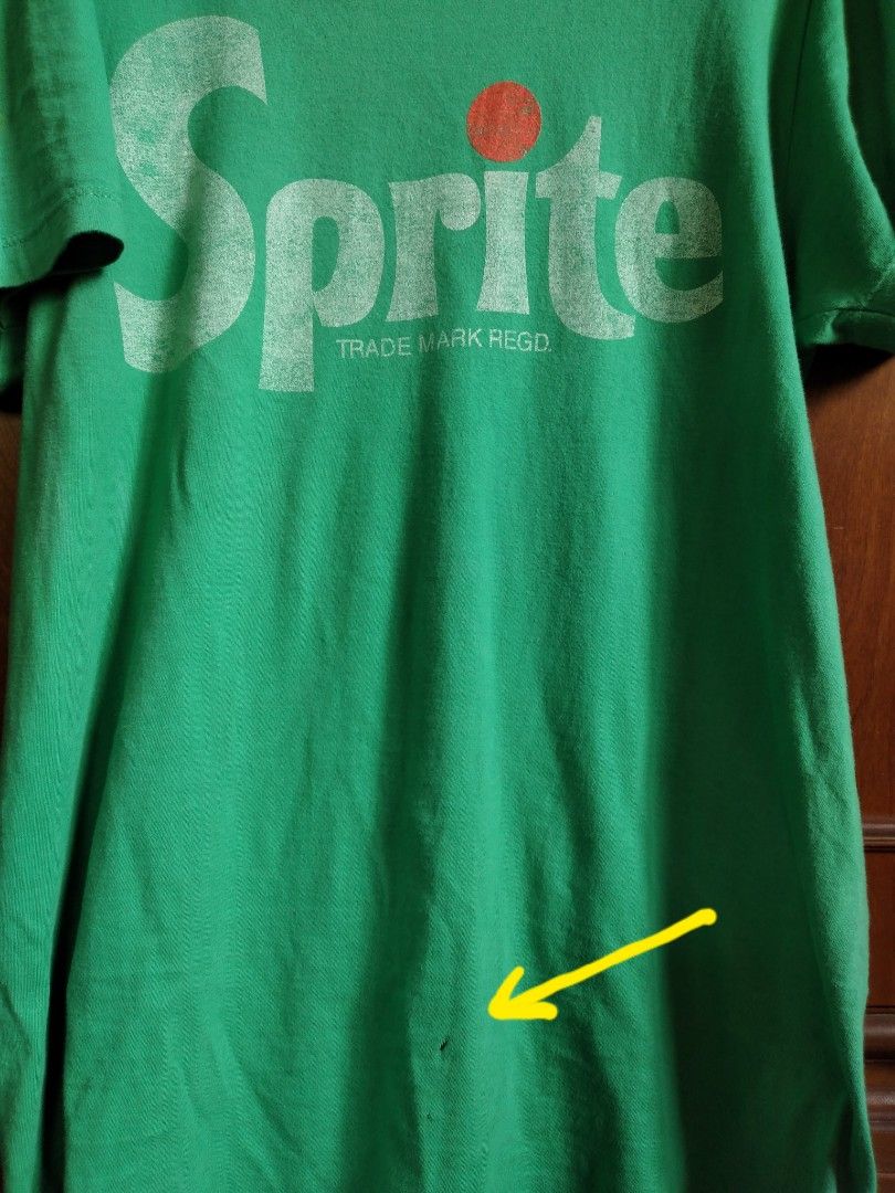Sprite Coca-Cola Green T-shirt - Medium (Category: Tshirts & Polo Shirts ) located in Baguio. Submitted by tipiditis (Listing ID 1422421108, Image 3). Description: - Green Sprite T-shirt - Features the Sprite logo - Size: Medium - Material: 60% cotton, 40% polyester - Minor hole on the front and back - Plain green back Color: 6/10 because of the fading at shoulders area and back (check photos) Size: Length 29 inches, Armpit to armpit 19 inches Ma