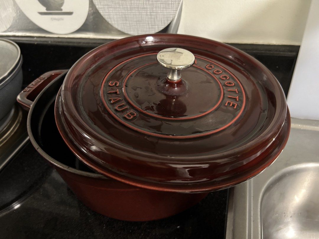 Staub Round Cocotte Garnet Red 24cm (Category: Cookware & Accessories) located in Makati City. Submitted by st.monica (Listing ID 1422494874, Image 1). Description: - Staub Round Cocotte - Color: Garnet Red - Size: 24cm - Features Staub logo on lid - IH compatible - Ideal for cooking various dishes.