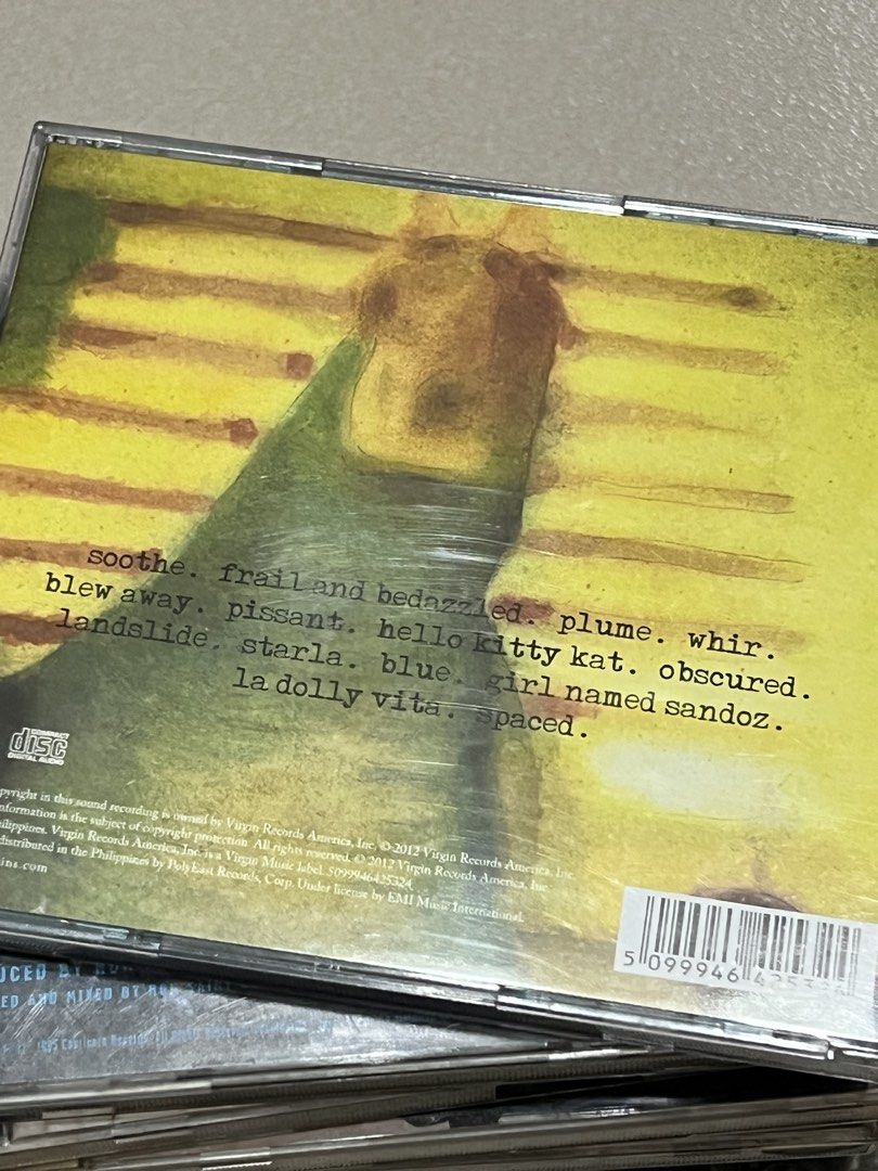 The Smashing Pumpkins Pisces Iscariot CD (Category: CDs & DVDs) located in Pasig City. Submitted by itsmejaypee25 (Listing ID 1422500911, Image 2). Description: Smashing Pumpkins' album, Pisces Iscariot, on CD. Includes the songs "Starla", "Landslide", and "La Dolly Vita". The back of the CD case lists the full tracklist, including "Soothe", "Frail and Bedazzled", "Plume", and "Whir". Published by Virgin Records..
