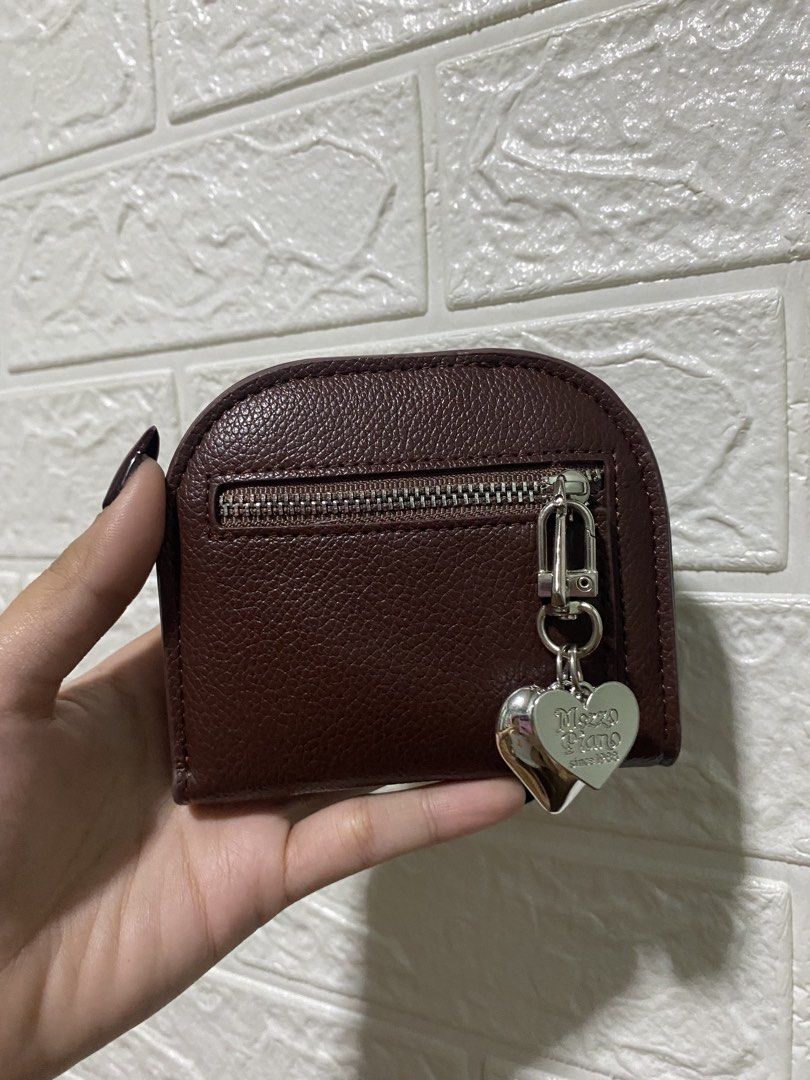Wallet Coin Purse (Category: Wallets & Card holders) located in Manila. Submitted by missthrift___ (Listing ID 1422470881, Image 1). Description: Coin purse features a dark brown exterior with a zipper closure. It has a silver heart charm attached. Inside, there are multiple card slots. The purse is secured with a snap closure. bought for 235 pesos .