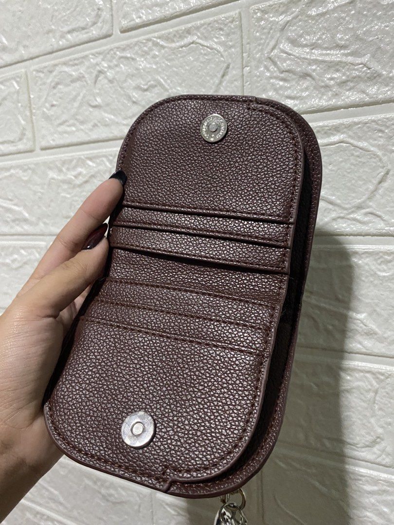 Wallet Coin Purse (Category: Wallets & Card holders) located in Manila. Submitted by missthrift___ (Listing ID 1422470881, Image 3). Description: Coin purse features a dark brown exterior with a zipper closure. It has a silver heart charm attached. Inside, there are multiple card slots. The purse is secured with a snap closure. bought for 235 pesos .