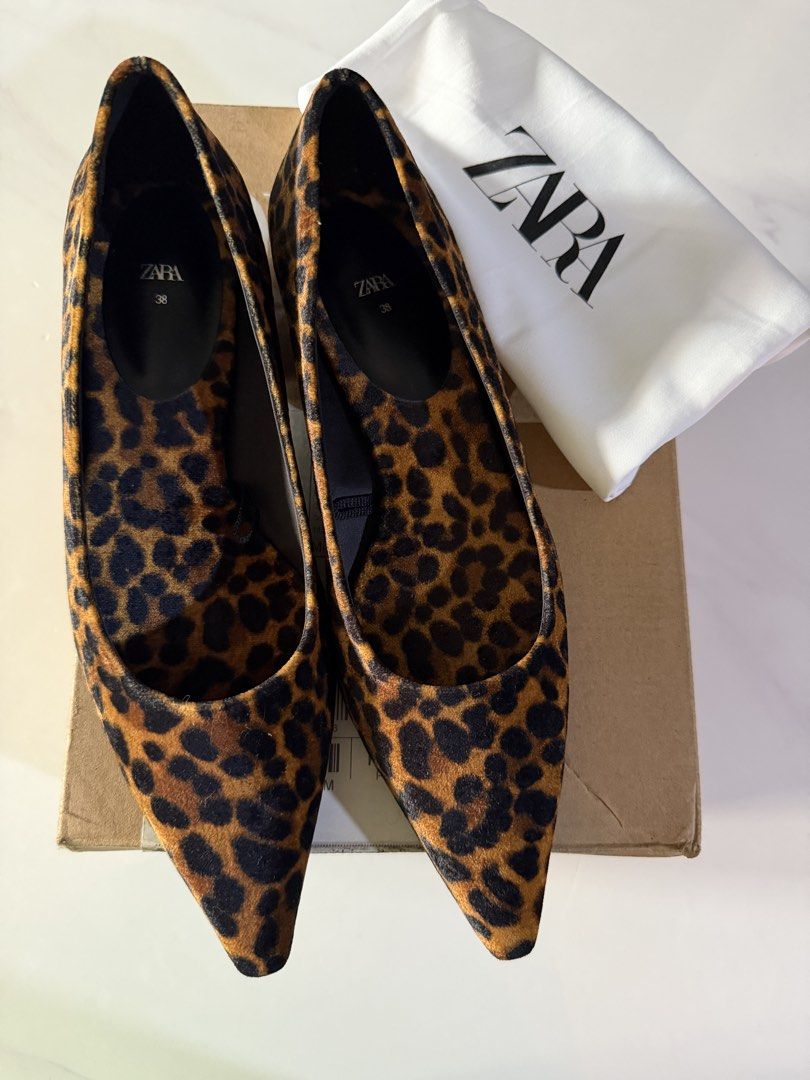 Zara Leopard Print Pointed Flats (Category: Flats & Sandals) located in Quezon City. Submitted by teetharejade (Listing ID 1422423675, Image 2). Description: Zara leopard print flats - Size 38 - Pointed-toe design - Includes dust bag and original box - Perfect for casual or dressy outfits.
