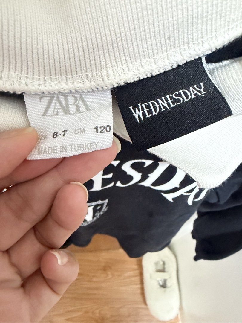 Zara Wednesday Sweatshirt (Category: Babies & Kids Fashion) located in Manila. Submitted by eah0416 (Listing ID 1422401049, Image 2). Description: - Black sweatshirt with white collar - Features "WEDNESDAY" print and Nevermore Academy logo - Size: 6-7 (120 cm) - Long sleeves - Made in Turkey.